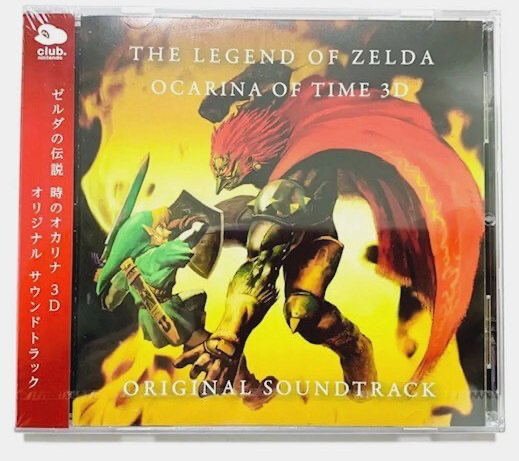 Ocarina of Time original soundtrack CD beside a blue twelve-hole ocarina