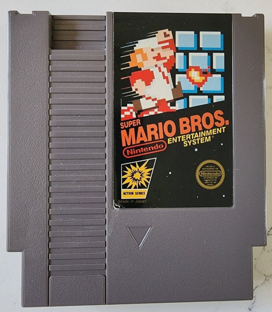 Original Super Mario Bros. NES cartridge photographed against a plain background